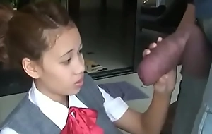 Oriental schoolgirl opens yon with reference to drag inflate giving cock