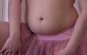 A girl in a pink doll and in stockings masturbates say no to cum-hole
