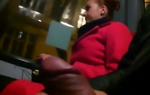 Juvenile woman near a red-hot coat on a bus