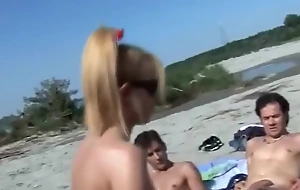 group fucking on a nude beach